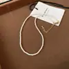Collar de perlas de azúcar con temperamento retro francés, cadena para suéter de moda Joker de alto sentido, joyería simple de nicho al por mayor