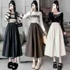 Nueva colección otoño/invierno 2026: Falda midi de corte A, moderna y elegante, estilo coreano, con cintura elástica, hecha de cuero PU