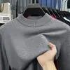 Suéter de cuello alto cruzado al por mayor para hombre, nuevo estilo otoño e invierno 2026, camiseta básica de punto versátil de color liso para hombres de mediana edad