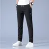 Versión coreana al por mayor de pantalones casuales de seda helada para hombre, verano, finos, tendencia laboral, holgados, de pierna recta, transpirables, pantalones deportivos