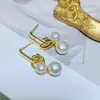 Coreia do Sul Dongdaemun 2025 Novos Brincos Pino de Prata s925 Banhado a Ouro Vento Frio Cruz de Metal Brincos de Pérola de Água Doce