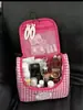 Bolsa de aseo rosa con forma de conejo de gran capacidad, una bolsa de almacenamiento espaciosa, una bolsa de cosméticos de viaje portátil hecha de cuero