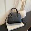 Otoño 2026 Nuevo Bolso de Concha Moda para Mujer Versátil Textura Bolso de Mano Retro Bolso de Hombro Cruzado Bolsos de Mujer al por Mayor