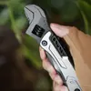 Llave de actividad multifuncional, camping portátil, ajuste multipropósito, herramienta multipropósito al por mayor, llave de acero inoxidable