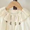 Nuevo Conjunto de Primavera y Otoño para Niñas: Conjunto de Dos Piezas de Camisa de Manga Larga y Falda Corta con Cuello de Encaje Dulce y Lindo, Ropa Infantil Transfronteriza