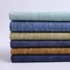 En stock poliéster imitación lino 28 Colores tela de lino grueso con recubrimiento de imitación de lino tela para bolsos suaves de primavera y verano tela decorativa de ingeniería sofá