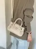Bolso de mano con patrón de lichi, bolso cruzado simple y elegante, nuevo modelo otoño 2026, diseño retro de nicho, bolso de hombro para el día a día