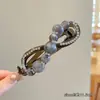 Pinza para el pelo con forma de ocho retorcido, con cuentas degradadas y pedrería, estilo coreano, para mujer, con un toque de alta gama, adecuada para la parte trasera completa de la cabeza, pinza banana para recogidos