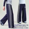 Calça Casual de Primavera para Meninas 2026 Novo Estilo Doce e Estilosa Renda Decorativa Patchwork Solta Confortável Calça de Moletom