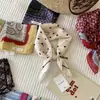 Algodón suave y lino transpirable aptos para la piel protección para el cuello cuadrado pequeño punto de ola flor de anacardo turbante exportación coreana bufanda individual bufanda de seda damas