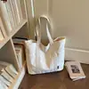 Bolsa Tote Grande de Gran Capacidad 2026 Principios de Otoño Nueva Casual Color Sólido Lona Elegante Bolsa Tote para Viajar al Trabajo Bolso de Hombro