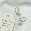 [gancho de cobre] concha marina perla tacones altos nicho gris aretes de perlas grandes aretes ins aretes de aguja plateada
