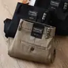 Estación europea pantalones casuales de alta gama para hombre otoño e invierno nuevos de lyocell antiarrugas microelásticos caqui negocios sueltos rectos
