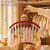 Cabide de roupas multifuncional em formato de abóbora amarela com prendedores e tiras antiderrapantes, ideal para secar roupas na varanda.