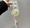 Cordón de cadena de cuentas de lunares se vuelve instantáneamente adecuado para teléfono Apple 17 iphone 16promax funda arcoíris color caramelo