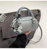 Bolsa de Bolos Portátil de Nicho para Mujer Verano 2026 Nueva Moda Bolso con Carcasa Texturizada Versátil Bolso de Hombro Cruzado