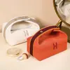 Bolsa de cosméticos con un toque de alta gama, simple y portátil, capacidad grande y pequeña, bolsa de mano para almacenamiento de cosméticos, bolsa de aseo de lona para influencers femeninas