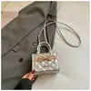 Textura retro minimalista 2026 primavera nuevo elegante de alta moda bandolera de un solo hombro para mujer con lazo