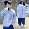 Chaqueta Camisa a Cuadros de Otoño para Niños 2026 Nuevo Estilo Camisa de Manga Larga de Primavera y Otoño para Niños Grandes Top de Moda Venta al por Mayor Transfronteriza