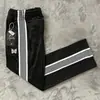 Pantalones de hombre Needles, marca de tendencia europea y americana de nicho, bordado de mariposa, a rayas, pierna ancha holgada, pantalones rectos casuales deportivos