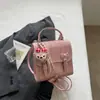 Mochila de Cuadros con Lazo para Mujer 2026 Nueva Simple Estilo Universitario Bolso Escolar Verano Versátil Ligero Mochila para Viajes Diarios