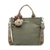 Bolso de mano simple, ligero y de gran capacidad para mujer, nuevo bolso de mano de verano 2026, bolso de hombro de lona para el día a día
