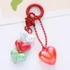 Nuevo llavero colgante de acrílico colorido de amor accesorios frescos de corazón de melocotón burbuja decoración de funda de auriculares bolsa