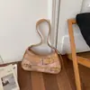 Diseño de moda estilo motocicleta para chicas con estilo 2026 casual popular elegante gran capacidad para ir al trabajo bolso de hombro cruzado para el antebrazo