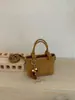 Bolso tipo cubo de tejido de alta gama para mujer, nuevo y elegante, estilo verano chic, de un solo hombro y cruzado