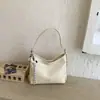 Bolsa de mão pequena super popular para mulheres, nova bolsa de ombro da moda primavera-verão 2026, bolsa transversal tipo saco versátil
