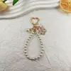 Llavero Colgante de Flor de Doble Color Perla en Viento Lindo Colgante Dulce de Flor de Cerezo Accesorios Colgantes para Bolsos de Teléfono Móvil Auriculares
