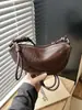 Venta al por mayor transfronteriza de bolsos tipo croissant de diseño nicho coreano, bolsos nuevos para mujer, bolsos versátiles vintage tipo bola de masa para hombro y cruzados
