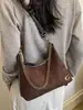 Bolso de axila de gamuza mate vintage para mujer, Nuevo bolso de hombro cruzado texturizado de nicho de alta gama Otoño/Invierno 2026