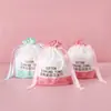 Bolsas de Embalaje para Toallas Faciales Universales en Stock, Bolsas con Cordón de PE Translúcido, Bolsas de Embalaje para Toallas Suaves de Algodón, Venta al por Mayor Directa de Fábrica