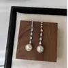 Pendientes Largos de Perla con Circonita de Lujo Ligero Elegantes de Gama Alta Diseño de Nicho Pendientes Retro Elegantes Pendientes de Presión Franceses