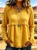 Blusa longa de manga comprida, estilo boho europeu e americano, com franjas, textura e amassada, gola redonda, corte solto e ombros caídos.