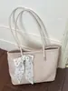 Bolsas de mujer al por mayor, nuevas bolsas tejidas vintage de gran capacidad para mujer, 2026 nuevos bolsos de hombro simples versátiles de otoño