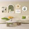 Sala de Estar Minimalista Moderna Pintura Decorativa Floral Mural de Pared de Fondo para Sofá Estilo Nórdico Crema Mesa Pequeña con Flores Combinación Pintura Colgante