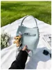 Bolsa balde elegante e estilosa com padrão de lichia, bolsa versátil para mães e filhas no dia a dia, nova bolsa de ombro e transversal super popular
