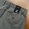 Nova coleção de outono: Calça masculina de alta qualidade, texturizada, sem elasticidade, com corte reto e folgado e feita de algodão de fibra longa para um caimento confortável e casual.