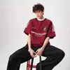 Camiseta de manga corta resistente con estampado de letras de tres rayas, estilo callejero americano para hombre, top de marca de moda de verano para pareja