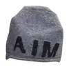 Gorro holgado de punto con letras grandes de color contrastante, elástico, adelgazante, rejuvenecedor, para mujer, otoño e invierno, cálido, versátil, moderno