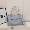 Primavera 2026 Nuevo Estilo Europeo y Americano Simple Gran Capacidad Casual Hebilla de Cierre Bolso Grande de Moda Tendencia Bolso de Hombro Cruzado para Mujer