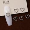 Nuevos accesorios de aleación para decoración de uñas con forma de corazón torcido tridimensional liso con diseño de amor hueco retro japonés