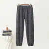 Nuevos estilos de otoño e invierno: Pantalones jogger de cuadros para mujer, cálidos, forrados de polar, de tiro alto, adecuados para madres de mediana edad, y se pueden usar como ropa exterior