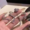 Pendientes con clip de oreja de serpiente de metal con circonitas del Año Nuevo para mujer, estilo chino, únicos y elegantes.