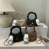 Bolsa de um ombro estilo coreano simples elegante bolsa de mão de bolinhas bolsa meia-lua feminina 2026 novo estilo personalizada para o dia a dia bolsa transversal