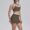Sujetador deportivo transfronterizo de nuevo color sexy en bloques de color con un elegante diseño en la espalda, falda de tenis transpirable de cintura alta y conjunto de yoga ajustado para mujer.