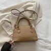 Bolsa de Mano Estilo Coreano con Forma de Concha Simple para Debajo del Brazo de Mujer Bolso de Hombro Individual Tejido de Color Sólido Nuevo Verano 2026 Bolso Cruzado para Viajar