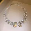 Colar com pingente oval em contas e diamantes, transfronteiriço europeu e americano, corrente para clavícula de luxo leve e de alta qualidade, acessório feminino requintado e versátil